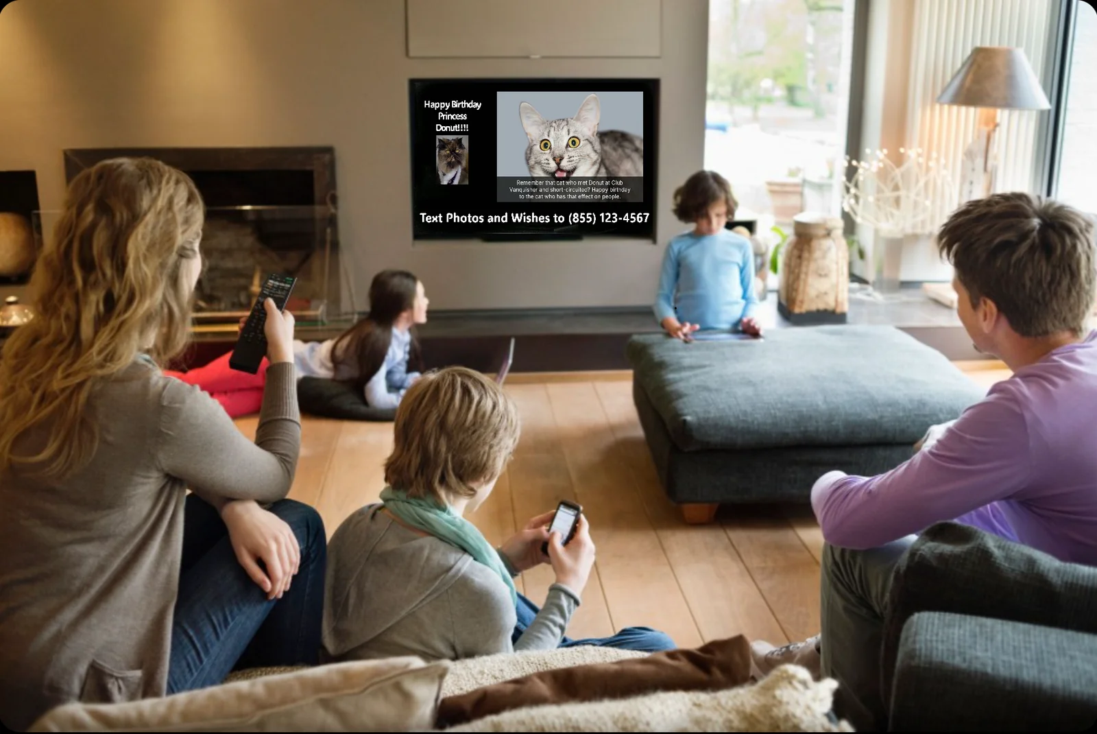 Family gathered in a living room watching the text2tv display on the TV